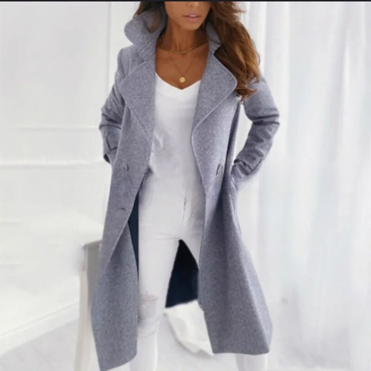 Comfortabele en stijlvolle lange trenchcoat met omgeslagen kraag voor dames